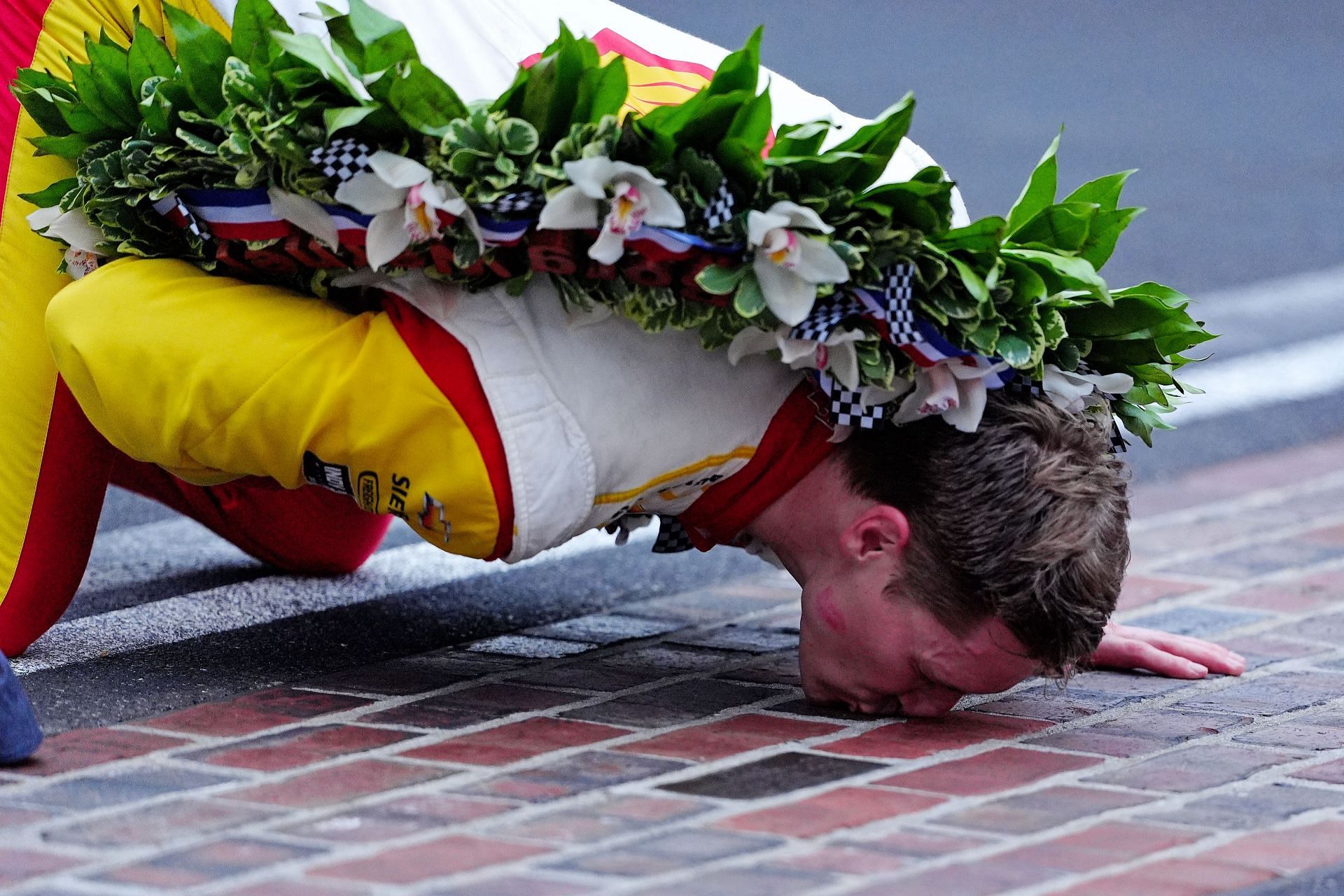 Josef Newgarden kissing the iconic bricks at the Indianapolis Motor Speedway after winning the 2024 Indy 500- Source: Getty